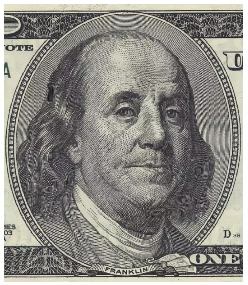 Macro shot of Benjamin Franklin on U.S currency